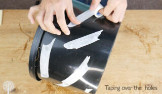 Taping the side holes for the mushroom bucket
