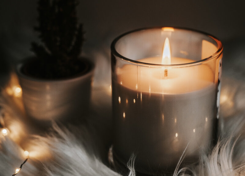 Image of a cozy self-care candle