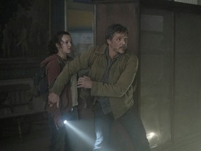 FILE - Pedro Pascal and Bella Ramsey in The Last of Us (2023).