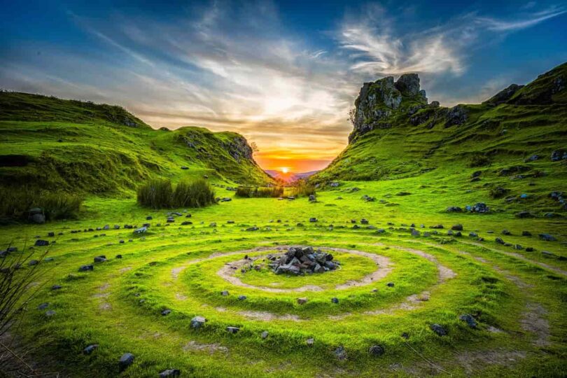Image of a green valley with a maze of ancient rocks symbolic of spiritual maturity